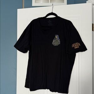 Universal Black Short Sleeve Tee with Gold Sleeve Print and Small Front Graphic